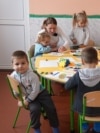 Moldova: Children and their teacher at the kindergarten in the village of Coșeni
