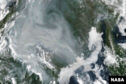 A satellite image, taken on July 5, showing the large clouds of smoke enveloping the Sakha Republic.