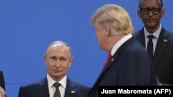Президент США Дональд Трамп и президент России Владимира Путина на саммите G20, ноябрь 2018 года