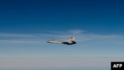 Снимок, опубликованный шведскими воздушными силами: российский МиГ-31 летит над Балтийским морем после того, как он нарушил воздушное пространство Эстонии. 19 сентября 2025 года