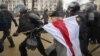 АМАП затрымлівае актывістку Ніну Багінскую на Дні Волі, 25 сакавіка 2017 году