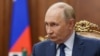 In this pool photograph distributed by the Russian state agency Sputnik, Russia's President Vladimir Putin attends a meeting with Russian Deputy Prime Minister at the Kremlin in Moscow on October 6, 2025. (Photo by Alexander KAZAKOV / POOL / AFP)